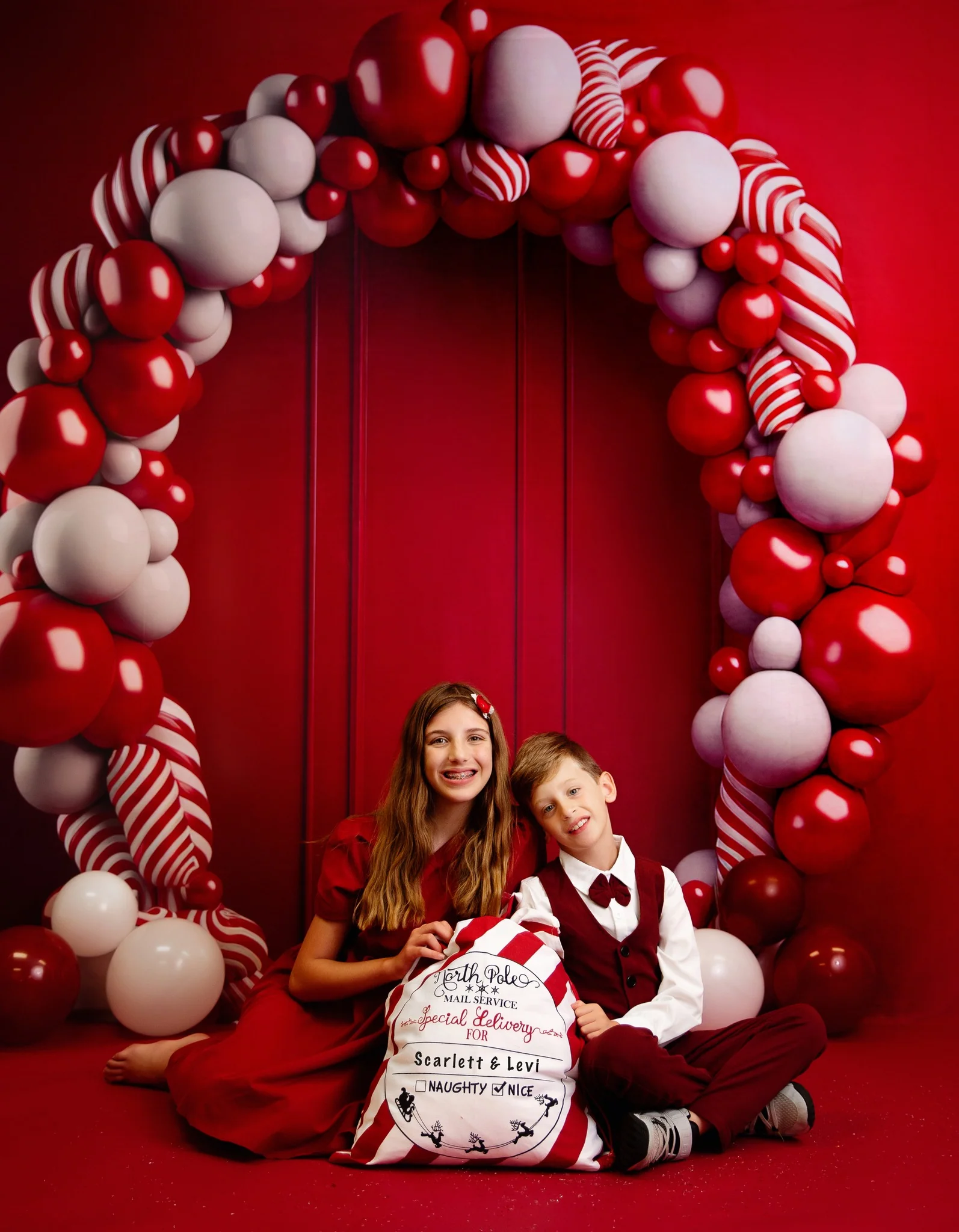 Kate Candycane Balloons Arch Red Wall Backdrop Designed by Megan Leigh Photography